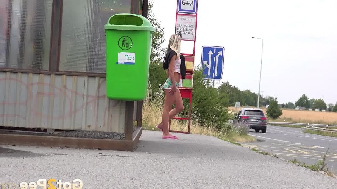 15P Claudia Macc pees in public at a bus stop