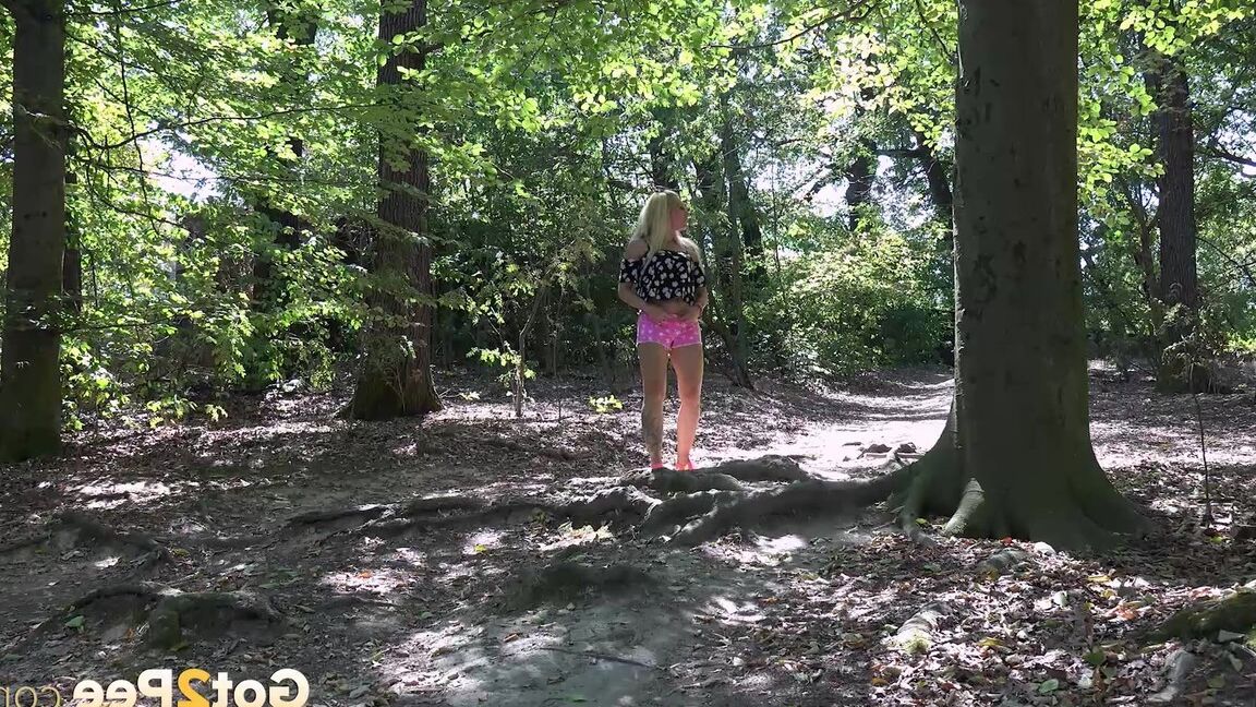 15P Hot blonde squats and pees on a tree stump