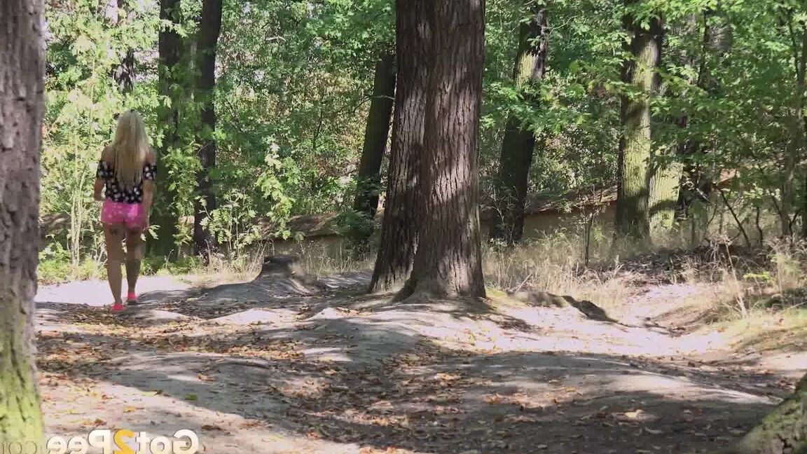 15P Hot blonde squats and pees on a tree stump