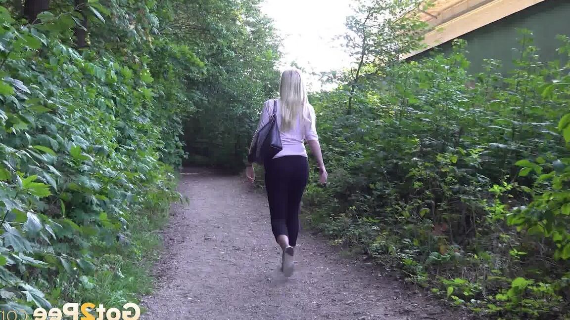 15P Pretty blonde Delphine relieves herself outside