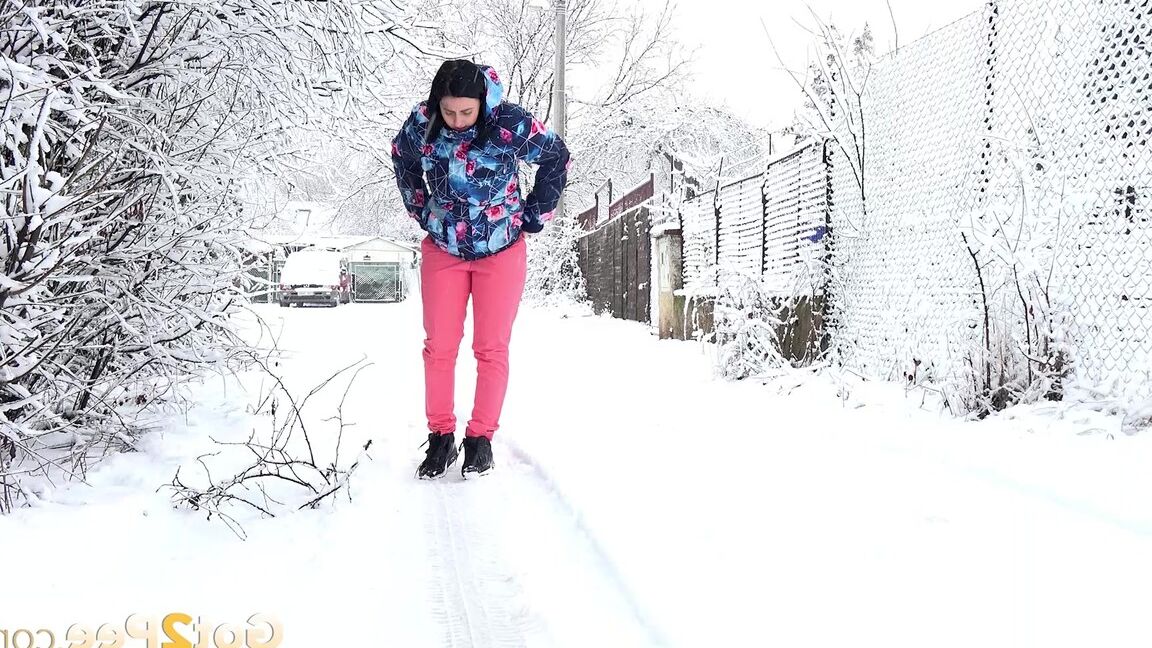 15P Gorgeous European babe squats to pee in the snow