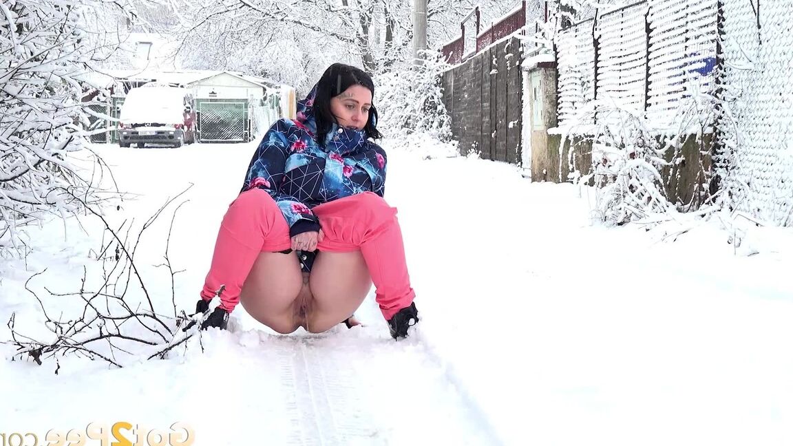 15P Gorgeous European babe squats to pee in the snow