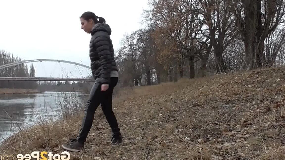 15P Antonia Sainz squats and pees near the river