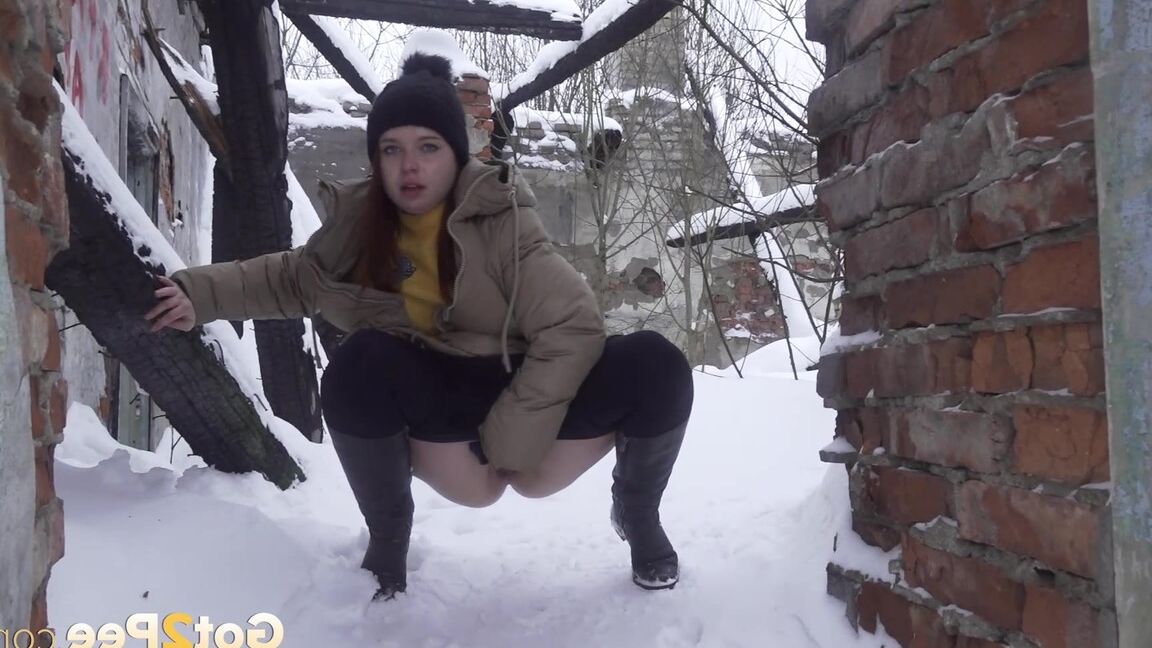 15P Cute babe squats and pees over deep snow