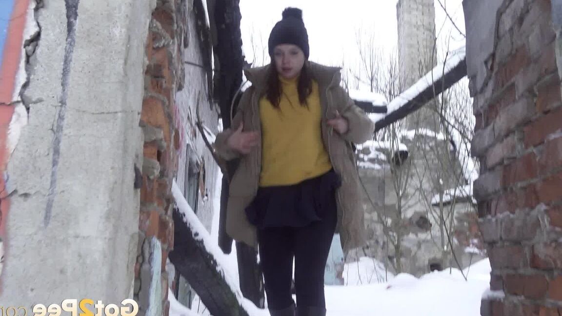 15P Cute babe squats and pees over deep snow