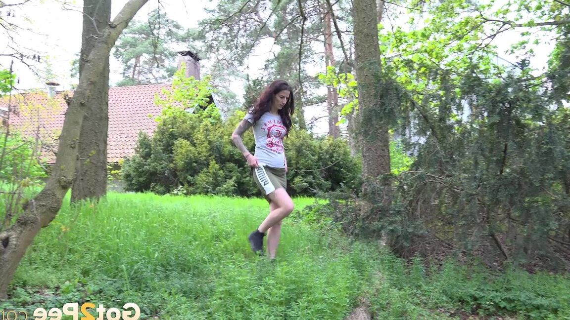 15P Ali Bordeaux squats to pee outside in the garden