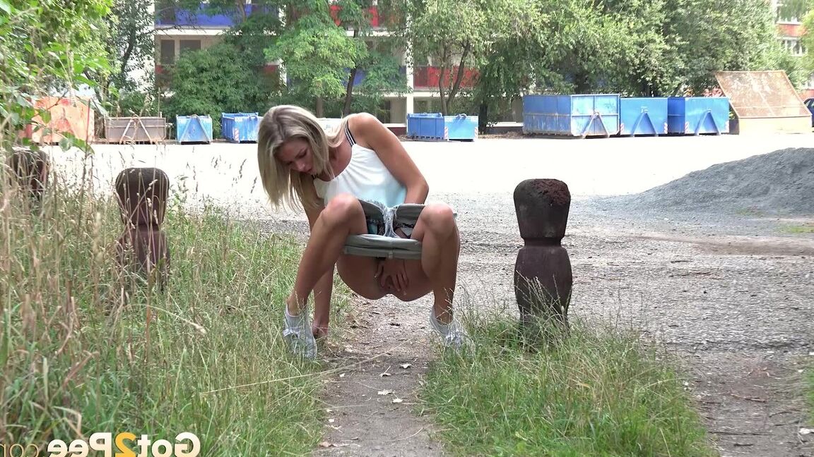 15P Gorgeous blonde Claudia Macc squats to pee