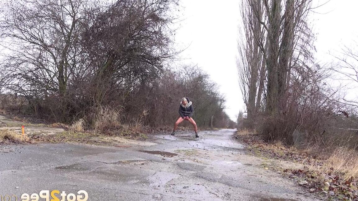 15P Blonde Claudia Macc pees while standing outside
