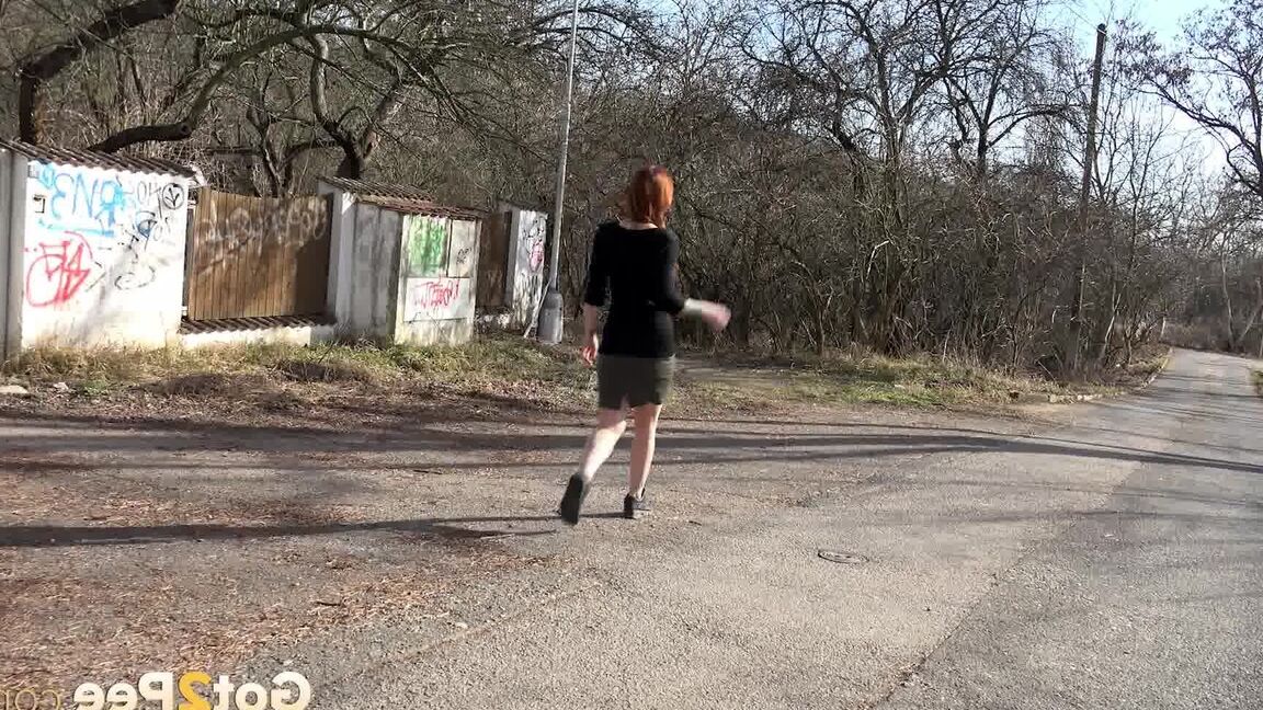 15P Gorgeous redhead pees in the middle of road