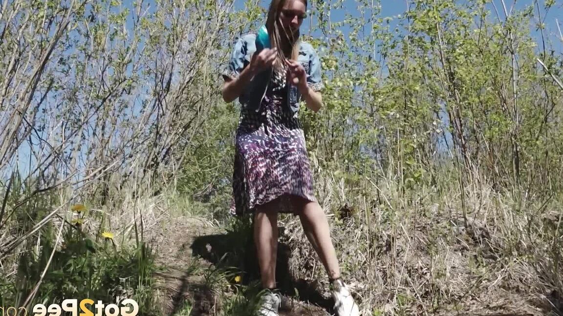15P Distressed girl Viktoria takes a badly needed piss on a bank in the outdoors