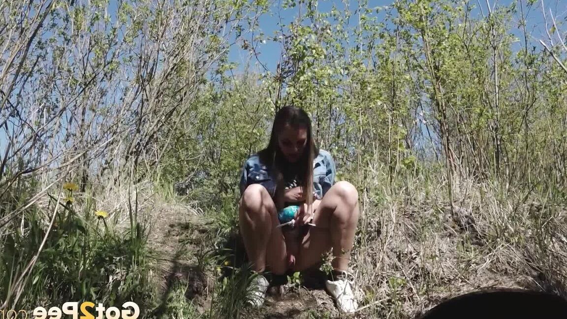 15P Distressed girl Viktoria takes a badly needed piss on a bank in the outdoors