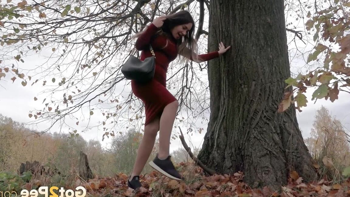 15P Distressed girl Sasha S hikes up her long dress to pee beside an old tree
