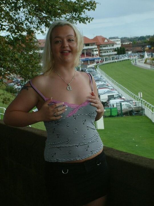 12P Blonde chick from the UK exposes herself in public with a view of a racetrack
