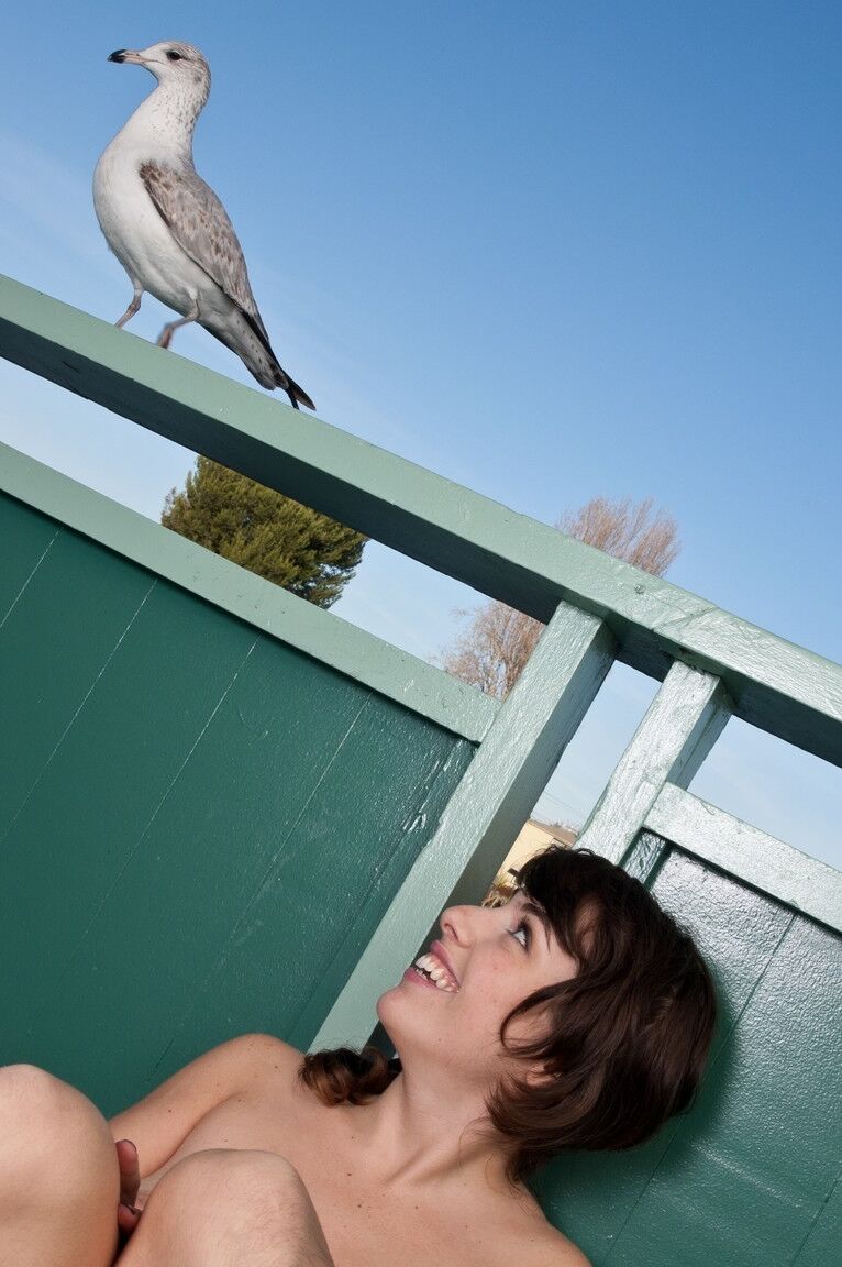 21P Small titted babe Simone exposes her bushy beaver and poses on the terrace