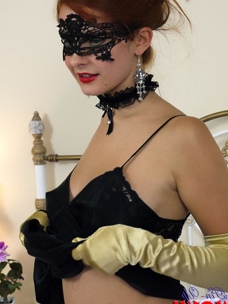 17P Sexy redhead Elle Richie removes long gloves while getting naked in a mask
