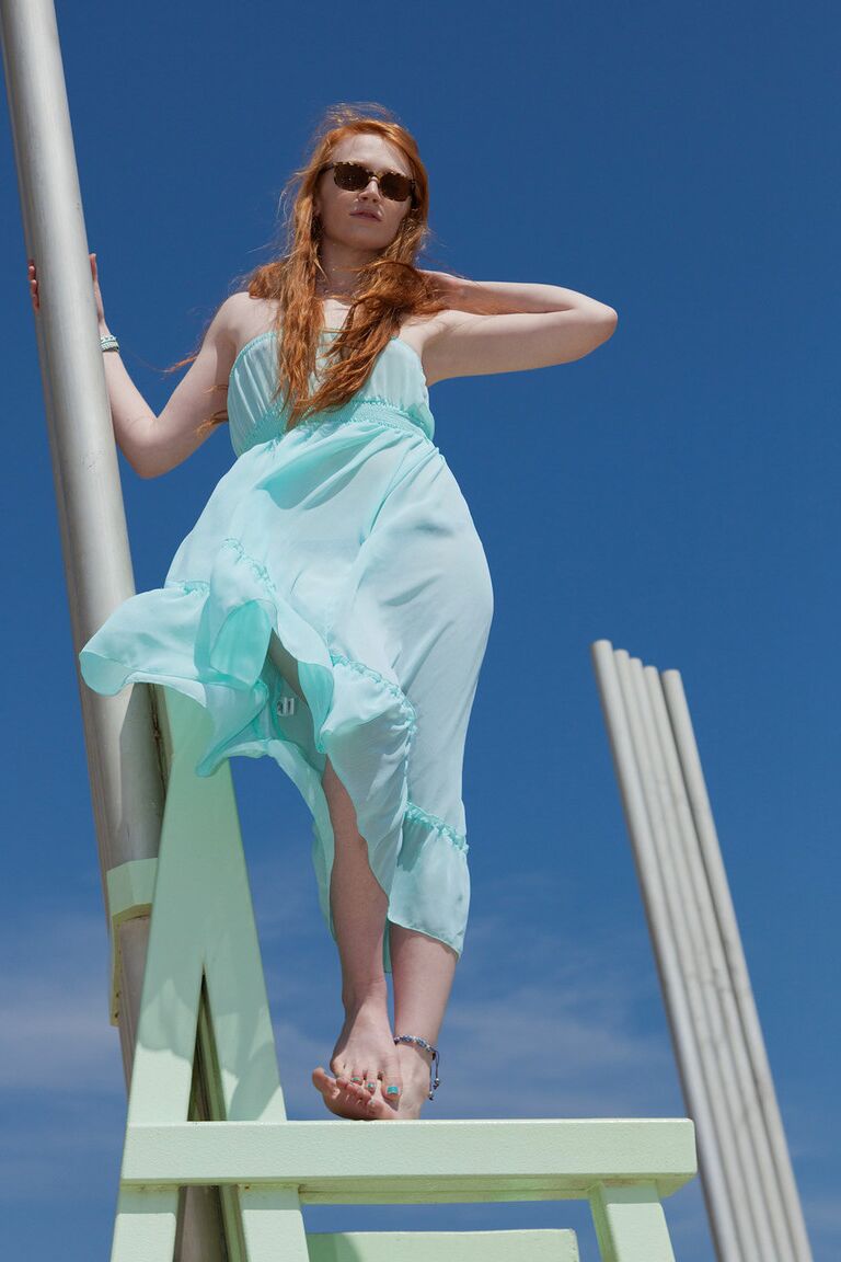 11P Redhead teen Bree Abernathy goes fr a walk outdoors in a see thru dress