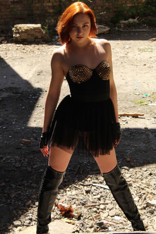 18P Natural redhead Valery Leche exposes her meaty labia lips in a concrete pipe