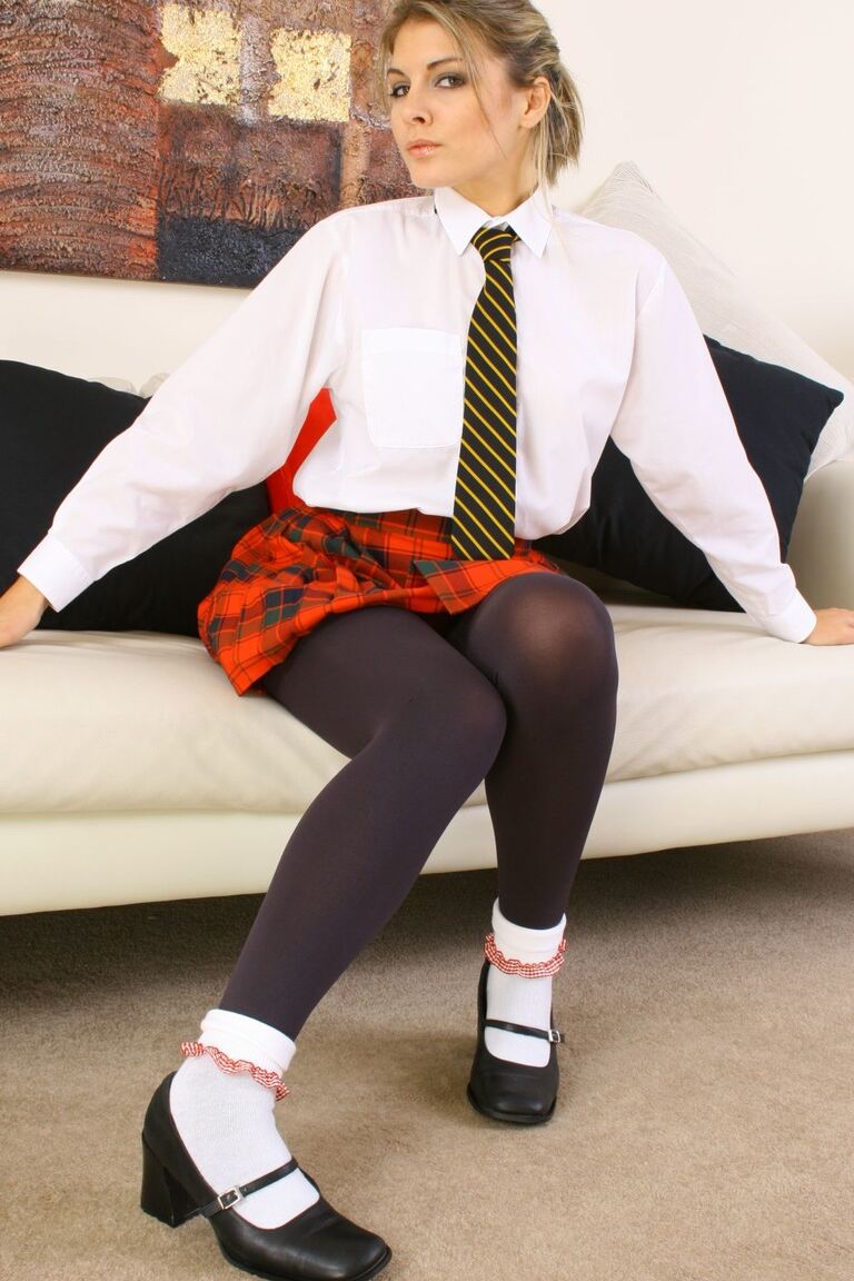 21P Schoolgirl Daisy Rose strips off uniform and tights before posing in panties