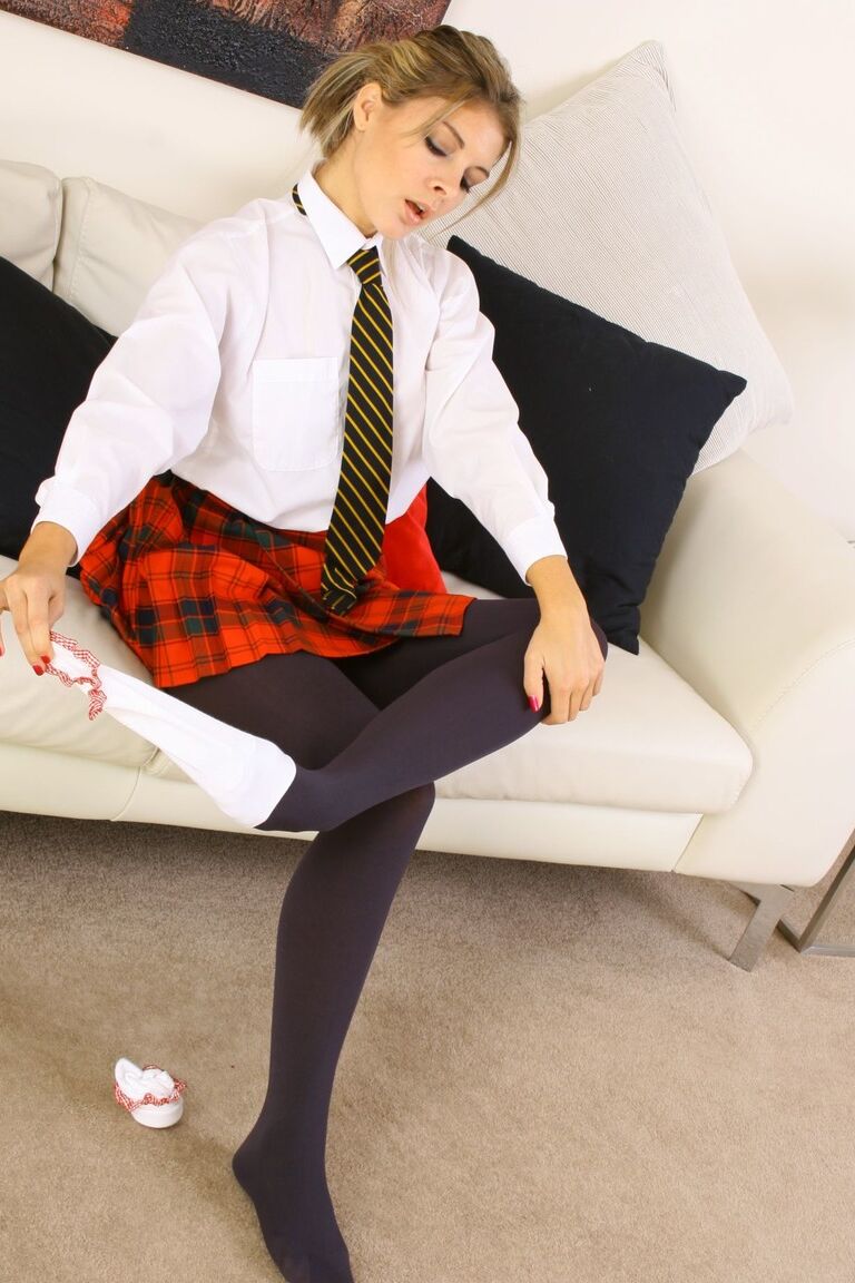 21P Schoolgirl Daisy Rose strips off uniform and tights before posing in panties