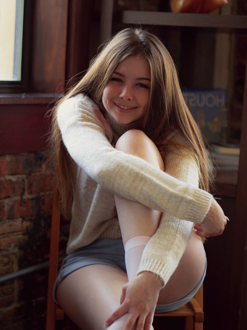 12P Gorgeous girl Lana Lea removes a sweater and shorts to model in the nude
