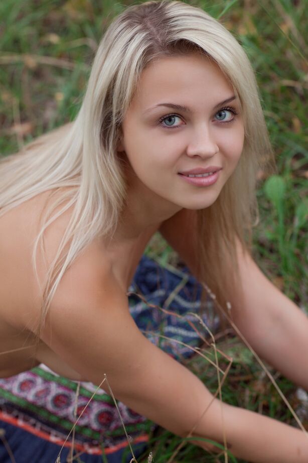 16P Attractive blonde Luciana romping naked in the long grass showing tits and ass