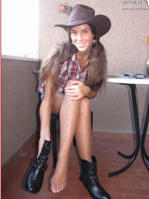 16P Amateur model Sweet Carla releases her hose covered feet from a pair of boots