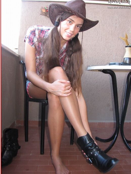 16P Amateur model Sweet Carla releases her hose covered feet from a pair of boots