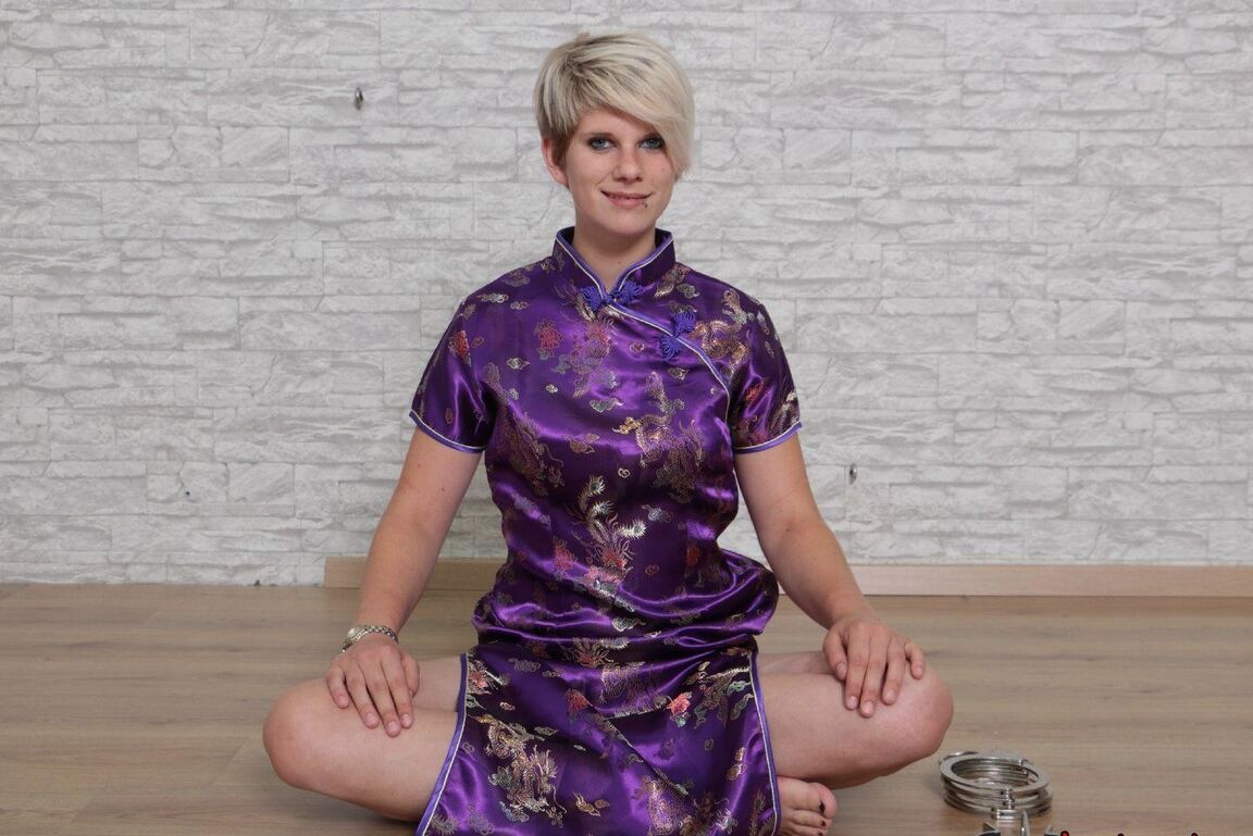 16P Short haired girl with piercings is restrained with cuffs wearing a kimono