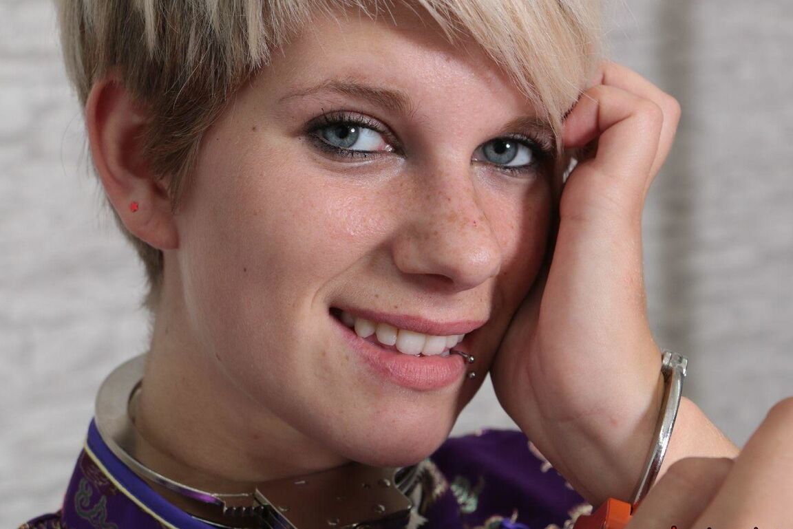 16P Short haired girl with piercings is restrained with cuffs wearing a kimono
