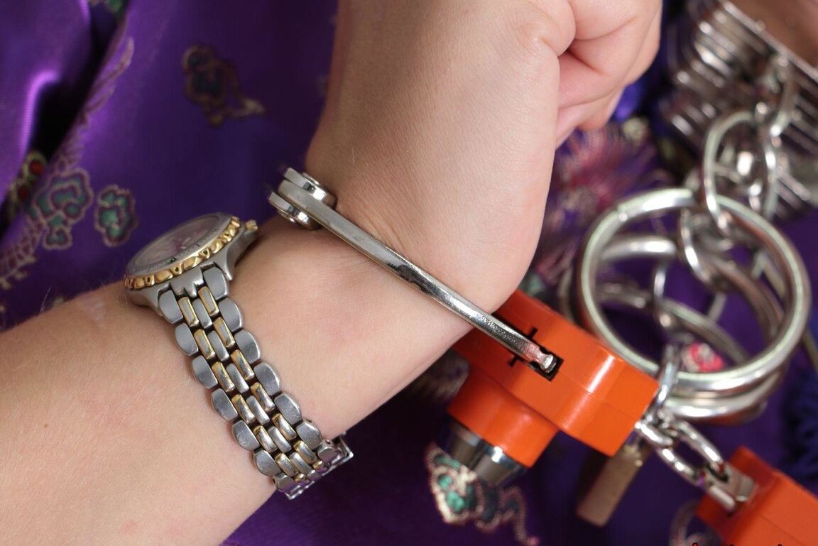 16P Short haired girl with piercings is restrained with cuffs wearing a kimono