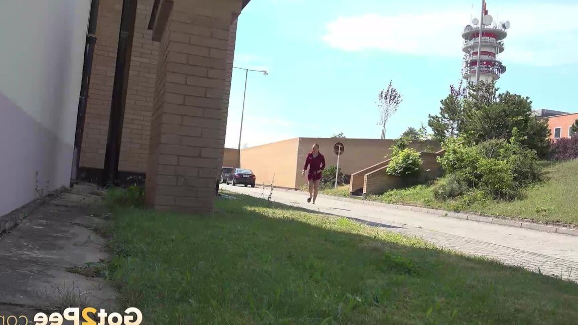15P Redhead babe Morgan squats to pee outside