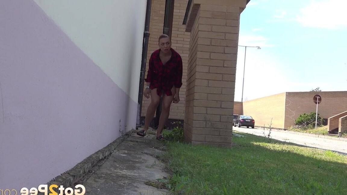 15P Redhead babe Morgan squats to pee outside