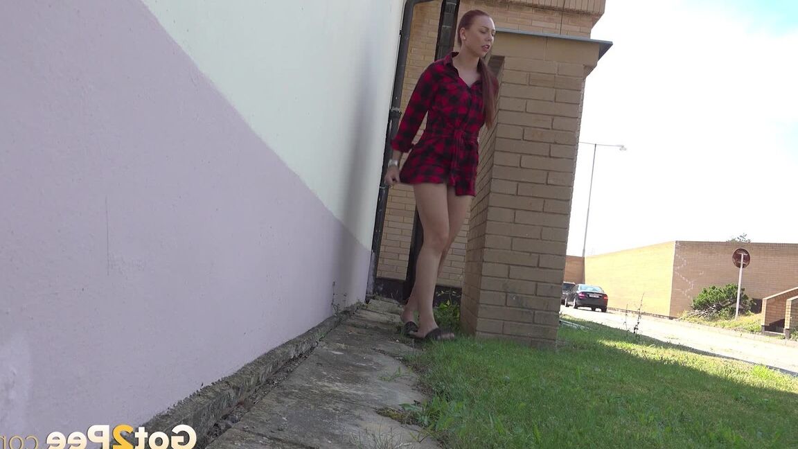 15P Redhead babe Morgan squats to pee outside