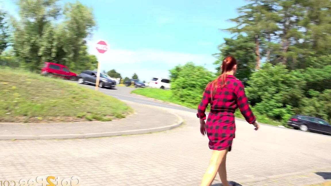 15P Redhead babe Morgan squats to pee outside