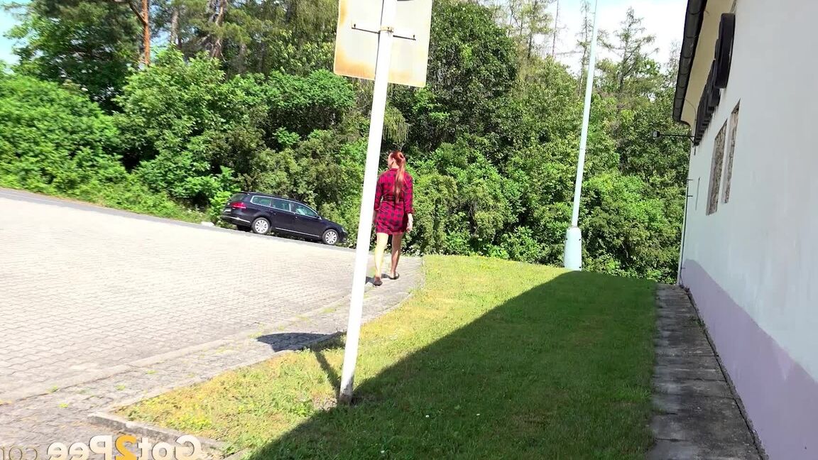 15P Redhead babe Morgan squats to pee outside