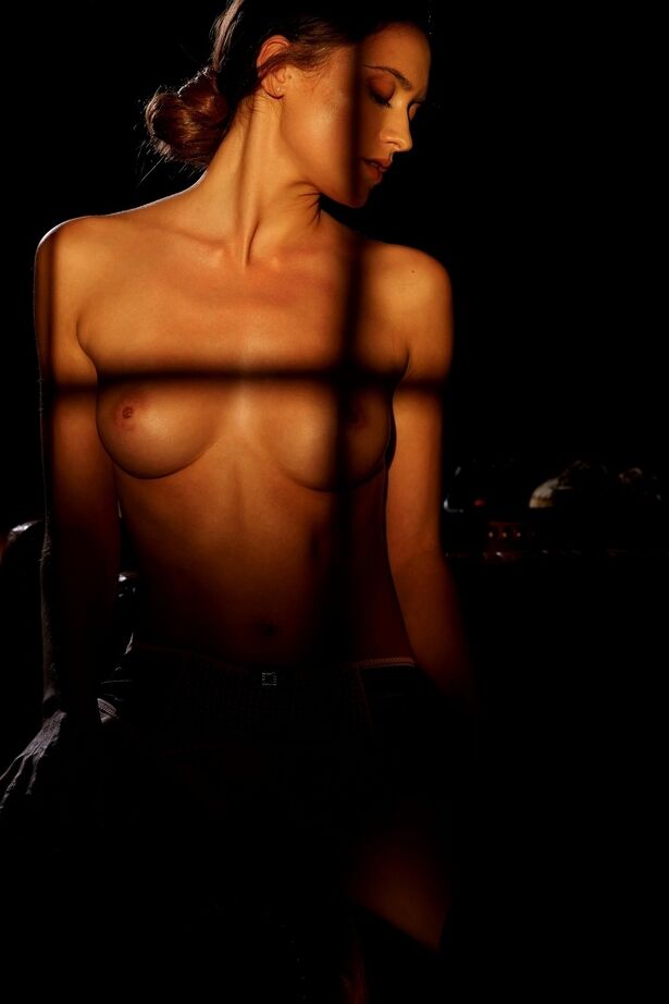 16P Solo model Deanna Greene enjoys a glass of alcohol while modeling for Playboy