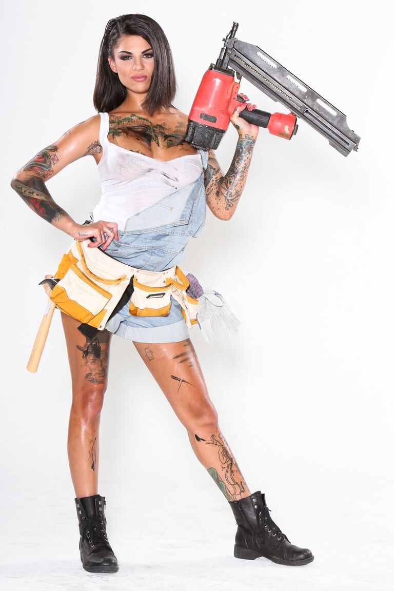 15P A group of tattooed females let their tits escape from skimpy work shirts