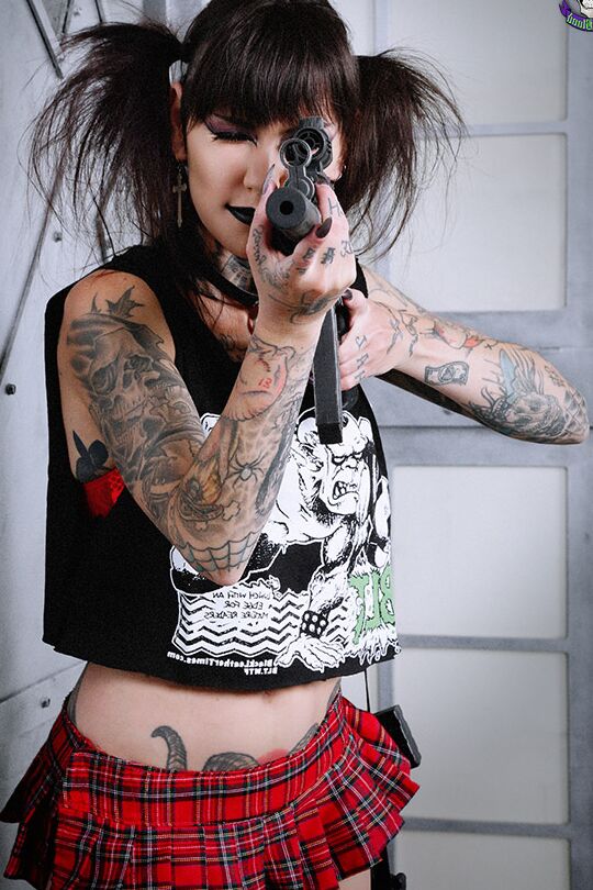 15P Tattoo enthusiast Malice Mcmunn strips to Doc's while handling guns