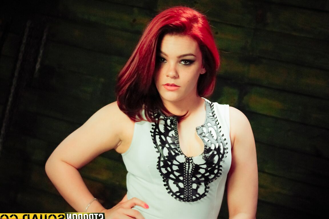 15P Redheaded submissive Kimber Woods gets banged by strapon lesbians in a dungeon