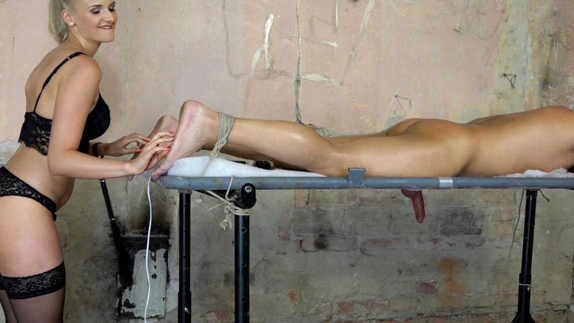 17P Female dominant Katy Sky torments a restrained man with a riding crop