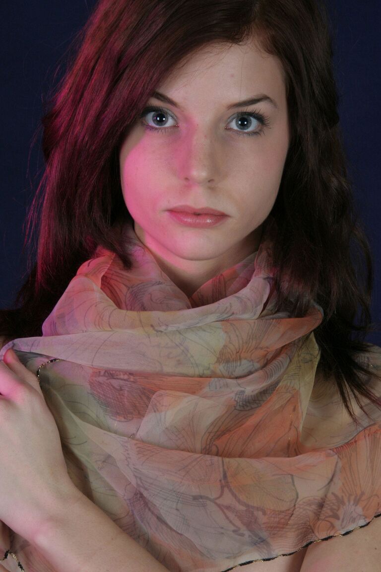 17P Solo girl with a pretty face and smile removes her clothes in a teasing way