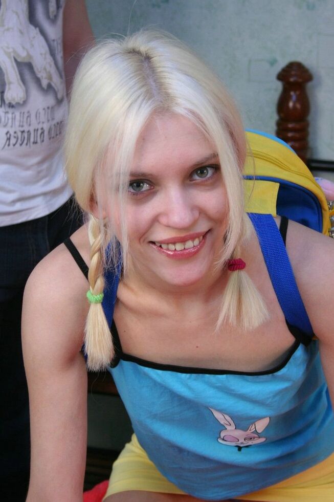 15P Young looking blonde eats a banana during close-up fucking on a bed