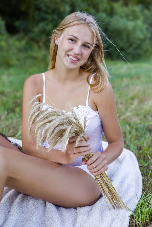 18P Young blonde Beti gets totally naked while having a picnic in a hay field