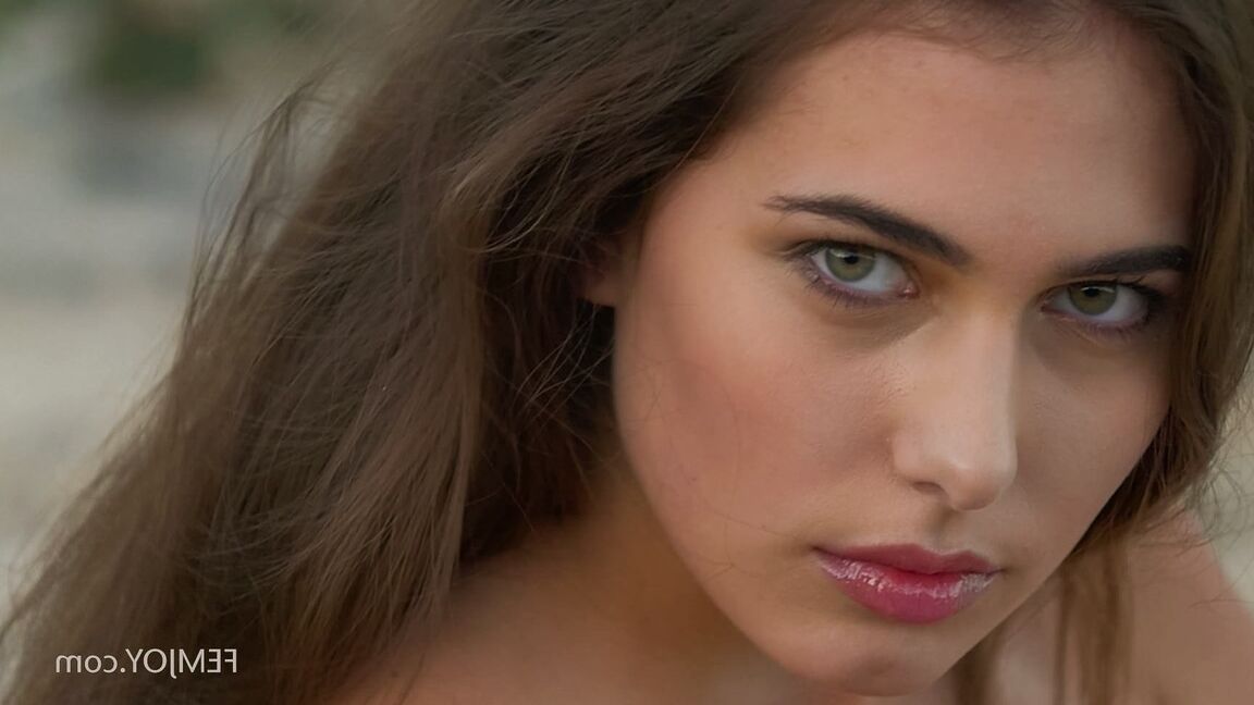 15P Stunning Cypriot babe Katrine Pirs stripping and posing on the rocky beach