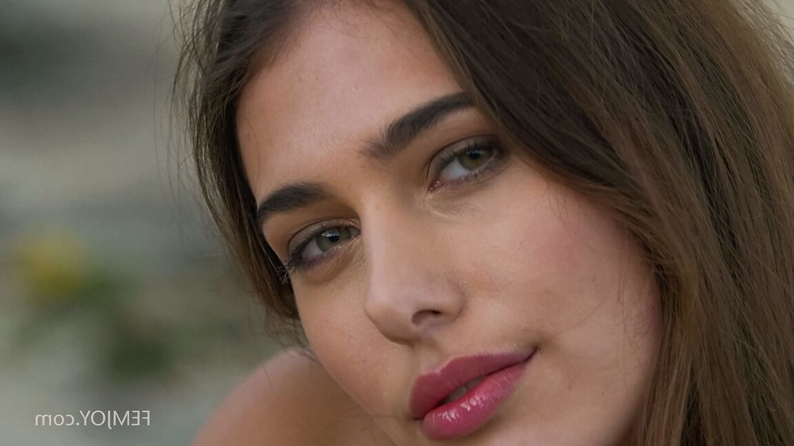 15P Stunning Cypriot babe Katrine Pirs stripping and posing on the rocky beach