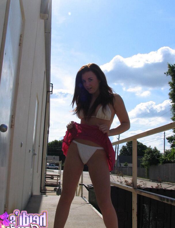 12P Amateur girl Heidi slides her bikini bottoms aside on a sidewalk