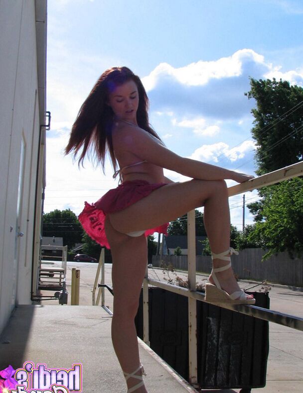 12P Amateur girl Heidi slides her bikini bottoms aside on a sidewalk