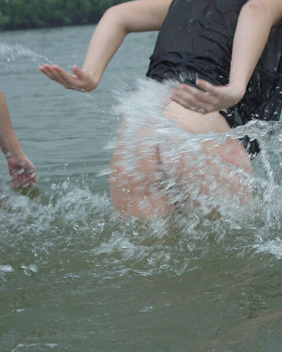 16P Teen girls partially remove wet clothing after wading into a river
