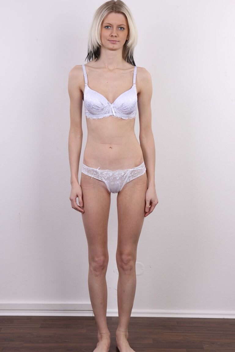 15P Dirty blonde Katerina stands fully clothed before doing the same in the nude