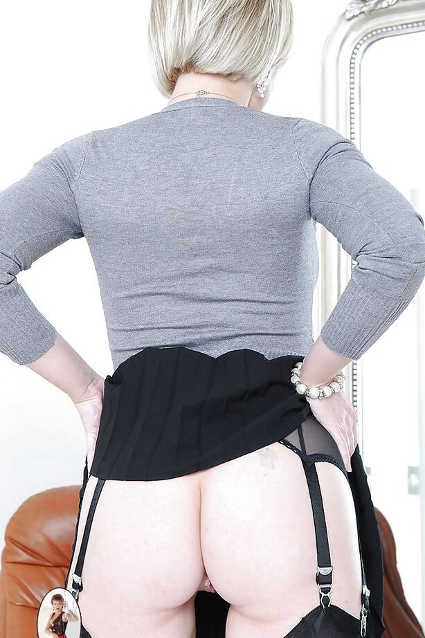 15P Curvy MILF in stockings uncovering her round boobs and ample ass
